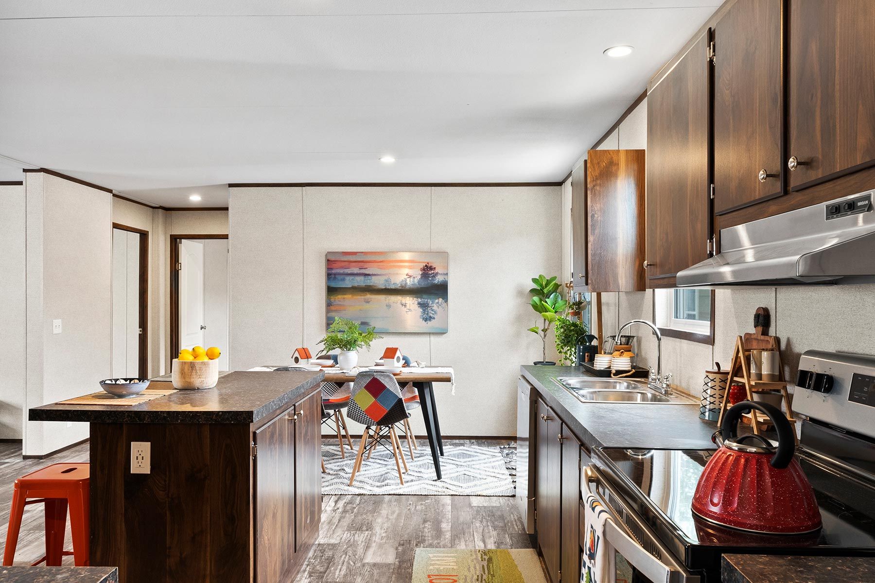 From above of ruler with pencil and glasses placed on paper sheet of house plan for construction