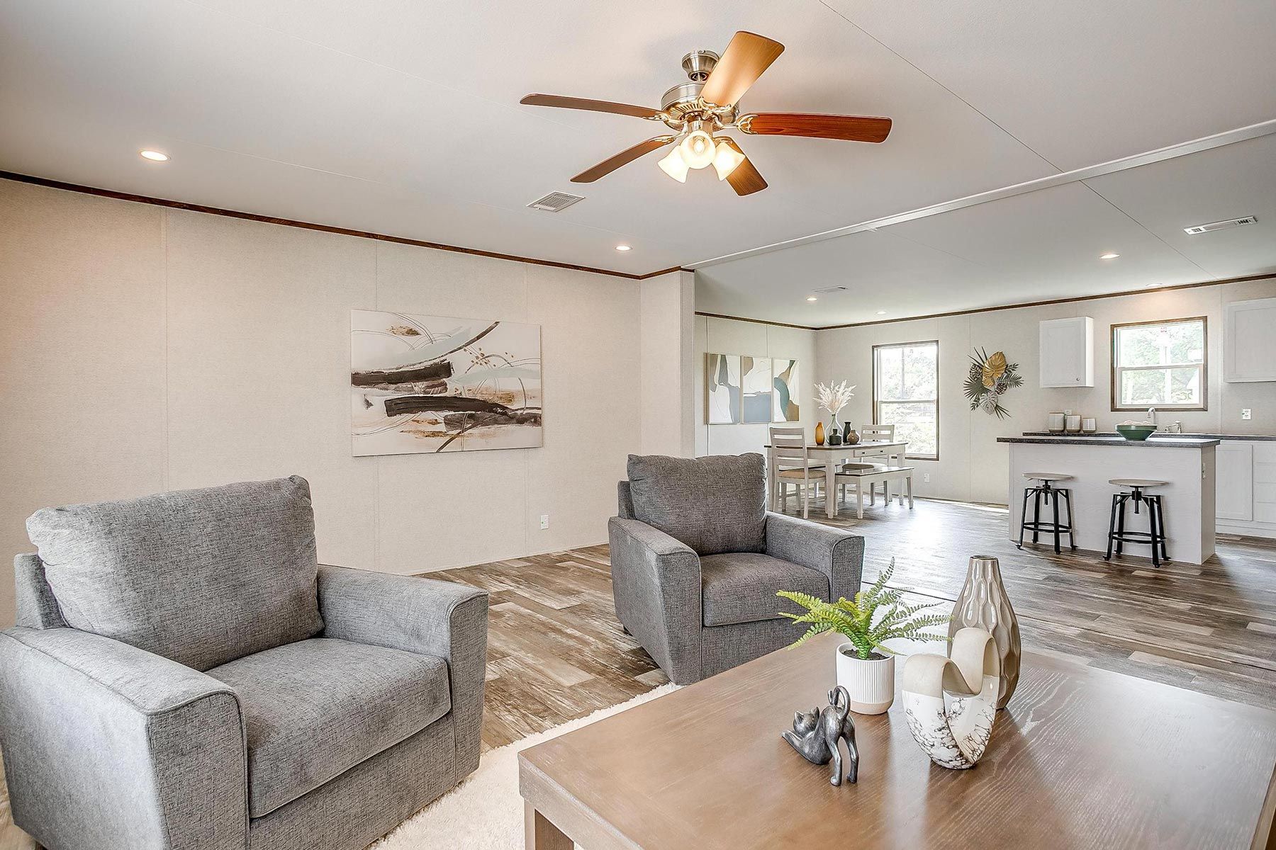 From above of ruler with pencil and glasses placed on paper sheet of house plan for construction