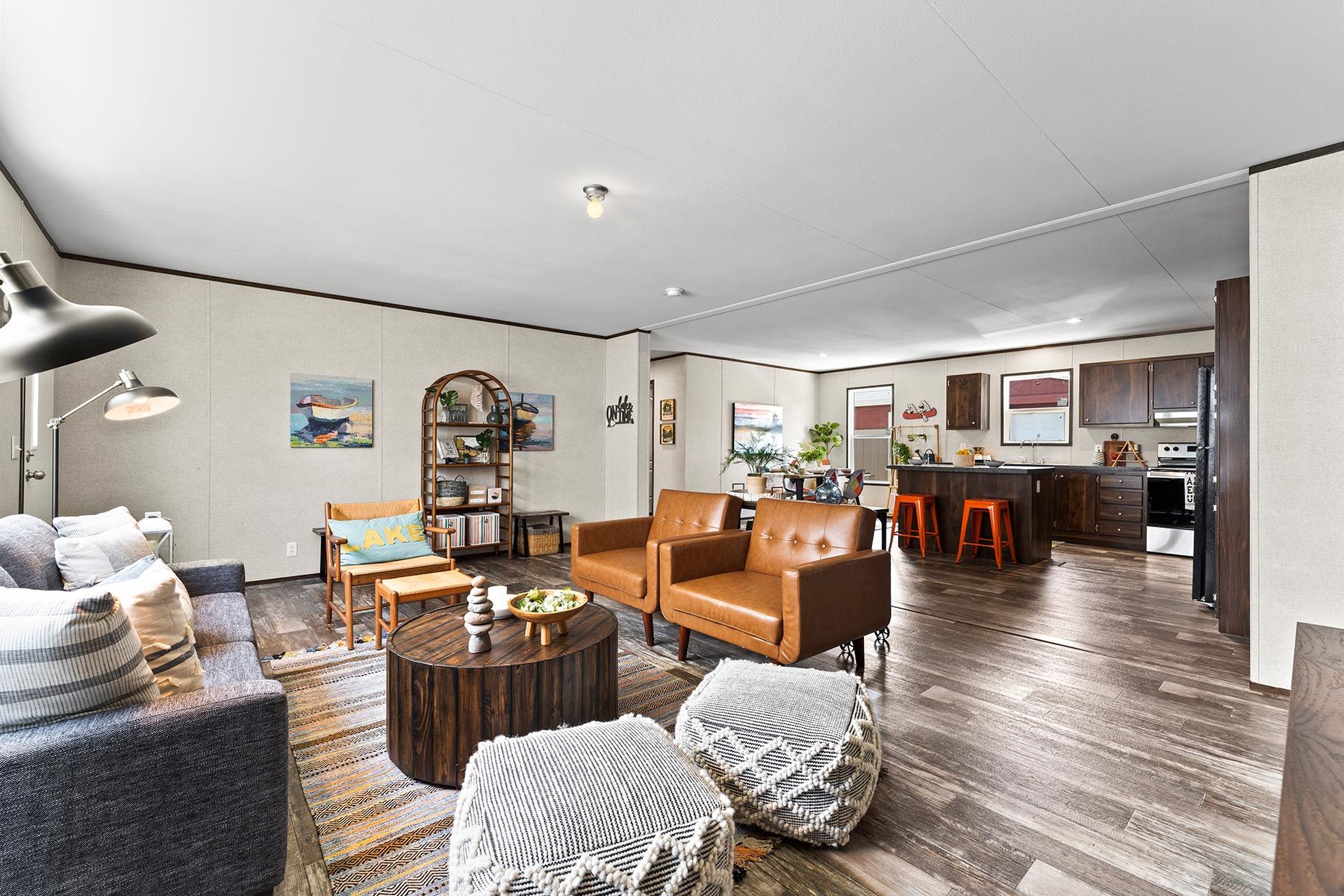 From above of ruler with pencil and glasses placed on paper sheet of house plan for construction