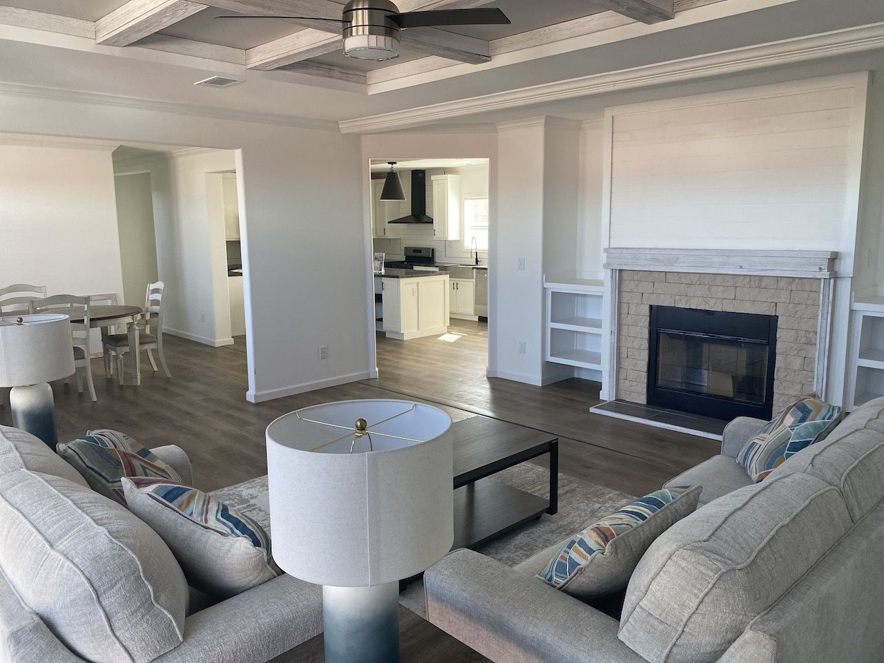 From above of ruler with pencil and glasses placed on paper sheet of house plan for construction