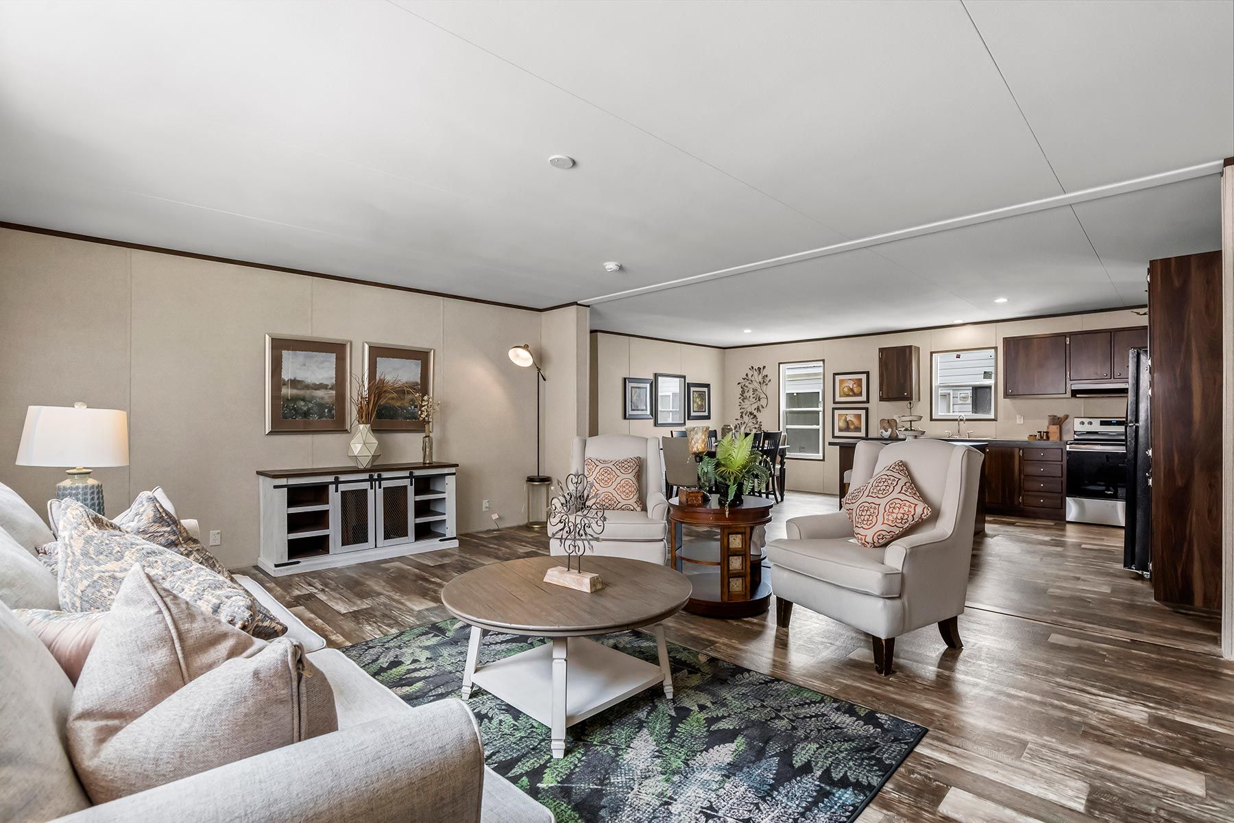 From above of ruler with pencil and glasses placed on paper sheet of house plan for construction